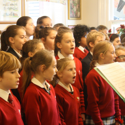 Hurst College children sing for the residents of Ladymead Nursing Home Event Image